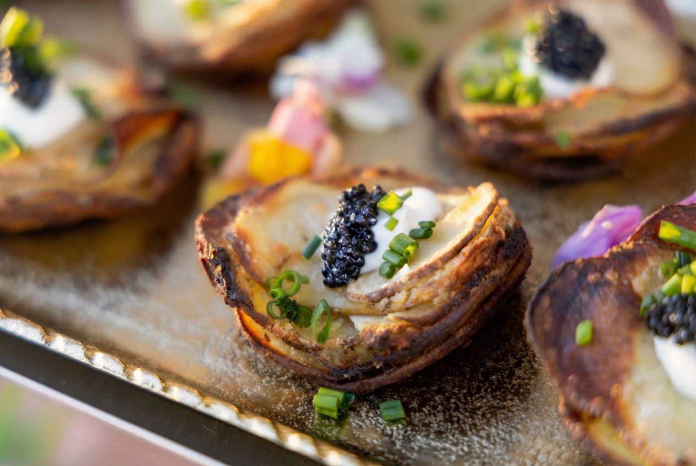 Crispy potato stacks with crème fraîche, caviar and chive